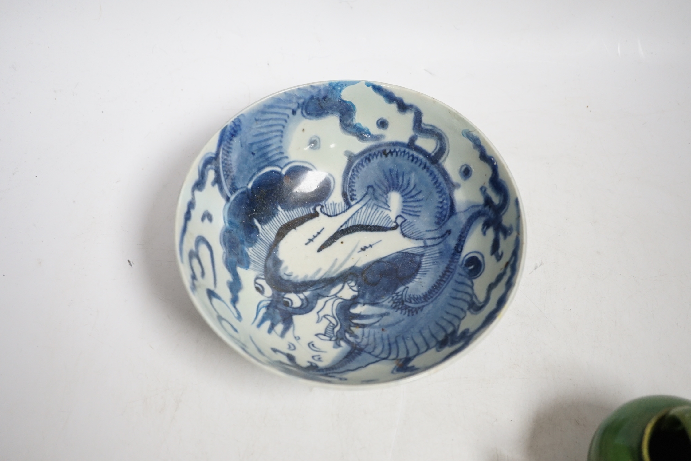 A Chinese blue and white ‘dragon’ bowl and a green glazed water pot, bowl 17.5cm diameter